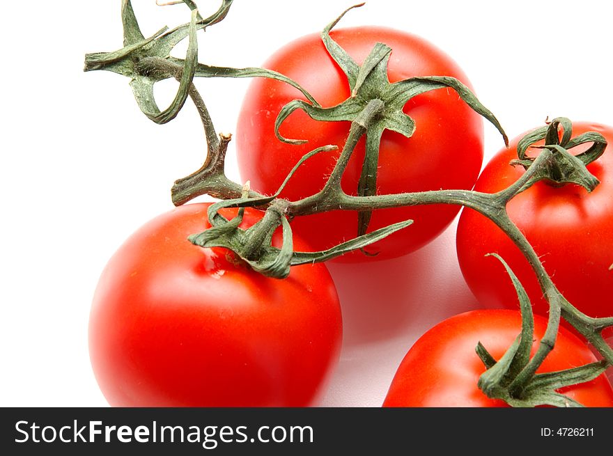Red tomatos cutted isolated on white. Red tomatos cutted isolated on white