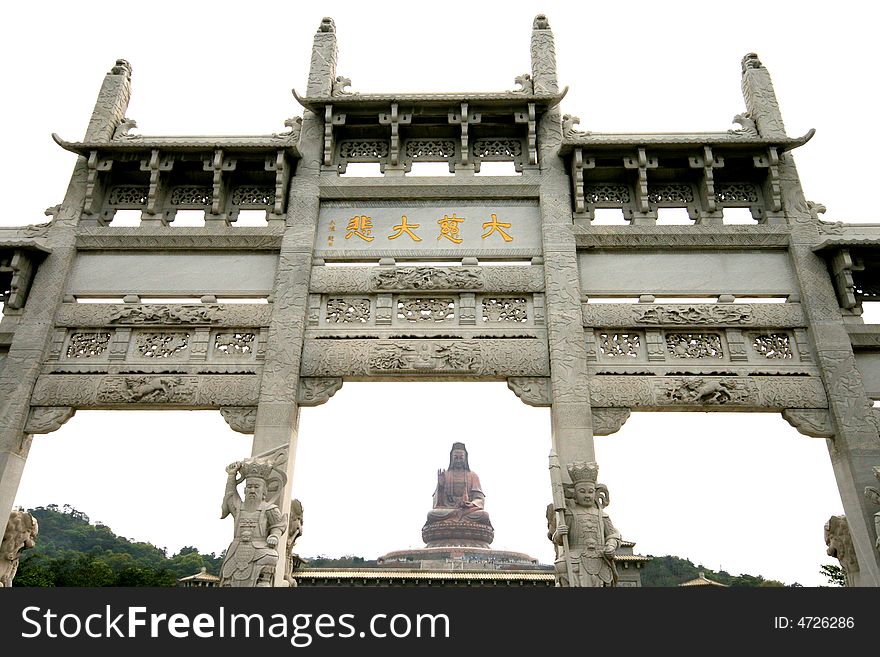 A Buddist marble archway and the bronze statue of Kwan-yin.This statue is 61.9M,which is the highest seating bronze statue for Arya Avalokiteshvaral in the world,located in Foshan,Canton,PRC. A Buddist marble archway and the bronze statue of Kwan-yin.This statue is 61.9M,which is the highest seating bronze statue for Arya Avalokiteshvaral in the world,located in Foshan,Canton,PRC.