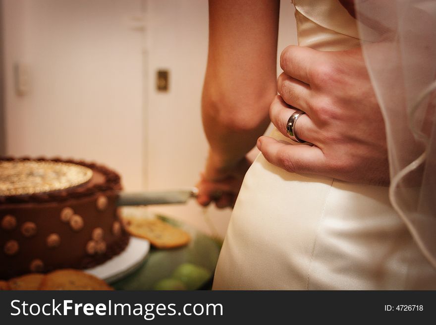 Beautiful wedding cake at a wedding reception about to be cut by bride groom. Beautiful wedding cake at a wedding reception about to be cut by bride groom