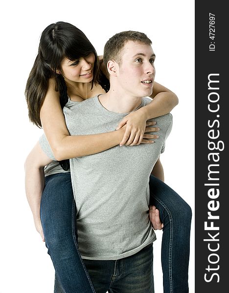 A young couple in love having a piggyback ride. A young couple in love having a piggyback ride