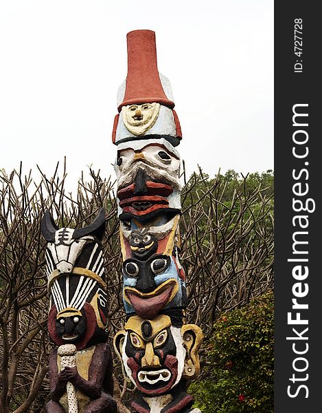 Totem pole ,serving among certain tribal or traditional peoples as the emblem of a clan or family and sometimes revered as its founder, ancestor, or guardian.