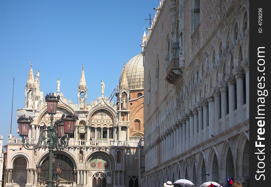 This pisturesque place is the corner of the world-famous Palazzo Ducale and the San Marco cathedral in Venice. The lanterns and the pigeons on them are also typically Venetian. This pisturesque place is the corner of the world-famous Palazzo Ducale and the San Marco cathedral in Venice. The lanterns and the pigeons on them are also typically Venetian.