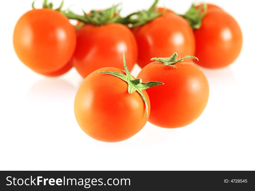 Nice fresh tomatoes over white background