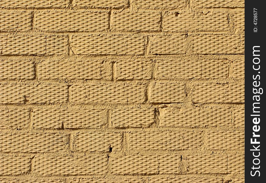 Beige colored rough brick wall texture. Beige colored rough brick wall texture