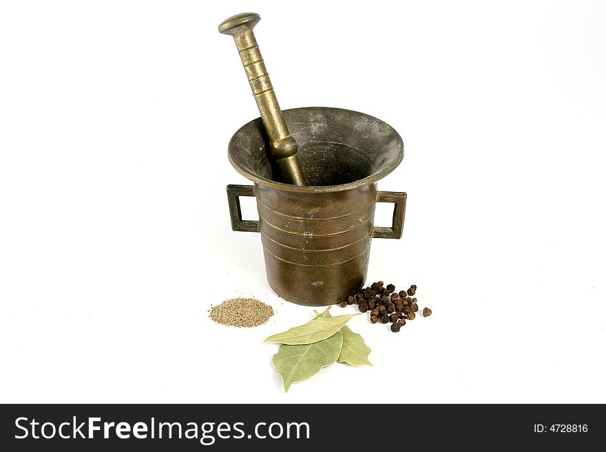 Brass mortar and pestle with condiments. Brass mortar and pestle with condiments