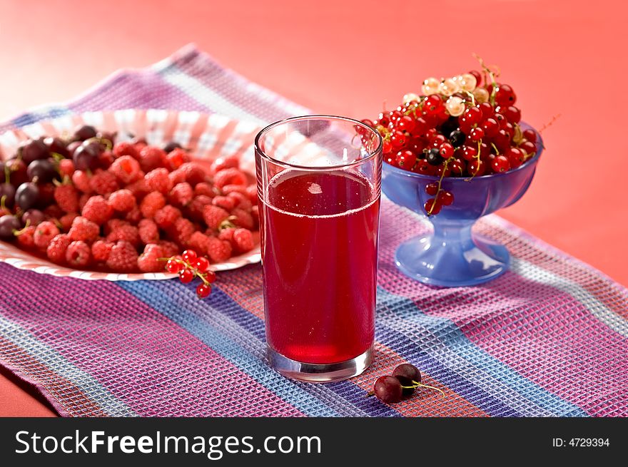 Fruit drink on the glass with berry. Fruit drink on the glass with berry