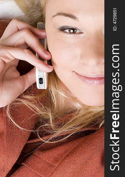 Sexy smiling businesswoman using mobile phone. Sexy smiling businesswoman using mobile phone