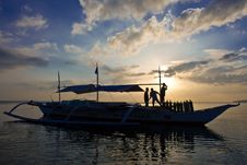 Unloading Banca Boat At Sun Set Royalty Free Stock Photography