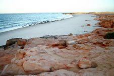 Beach With Red Rocks Stock Image Beach With Red Rocks Stock Image