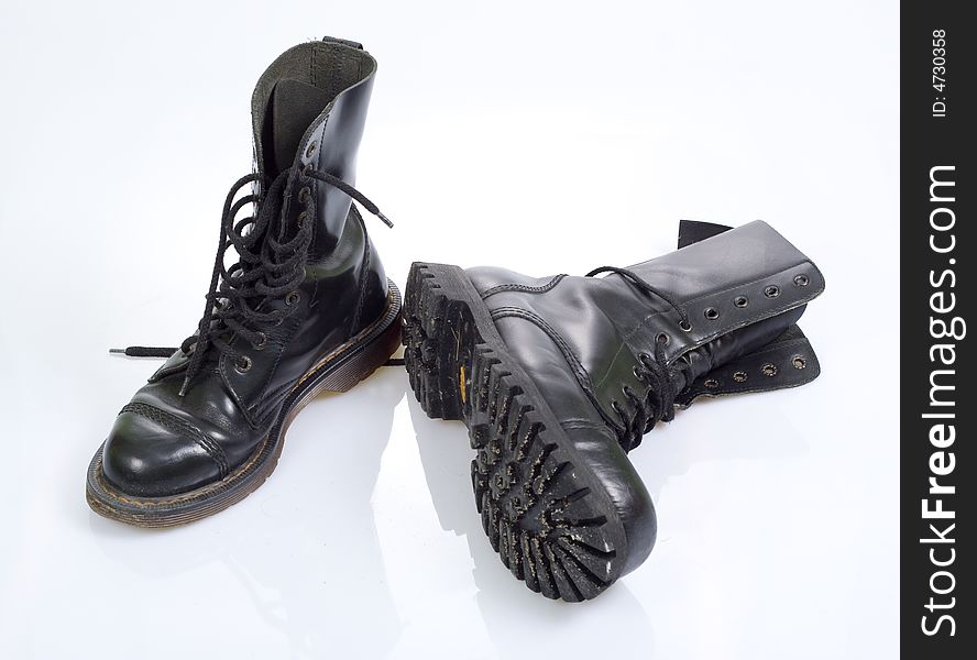 Two black military shoes, on white background. Two black military shoes, on white background