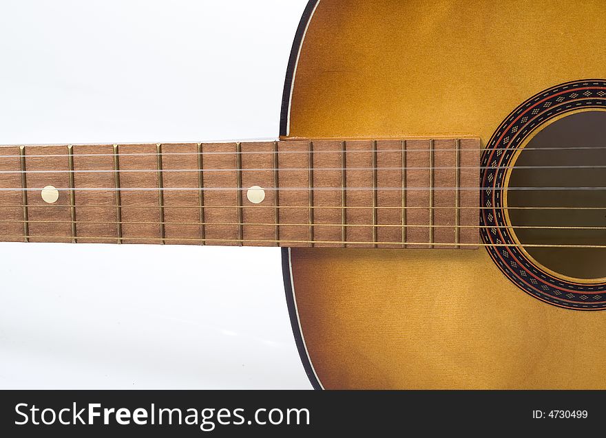 Fragment of acoustic guitar on white background. Fragment of acoustic guitar on white background