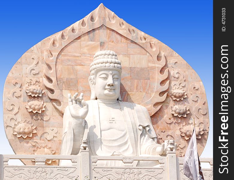 Marble Buddhist statue sitting in Rongcheng City, Shandong Province China. Marble Buddhist statue sitting in Rongcheng City, Shandong Province China