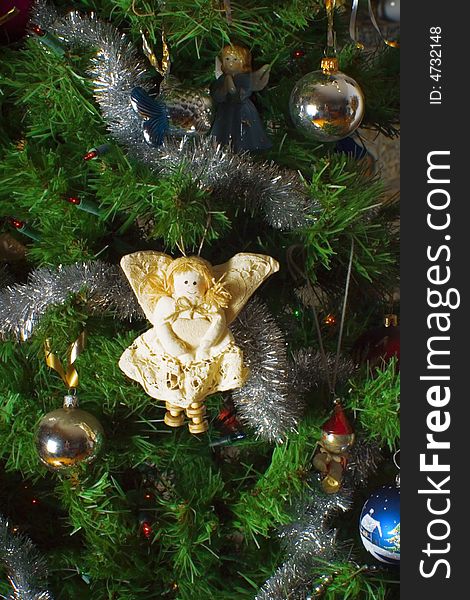 Christmas decorations on tree as a background. Christmas decorations on tree as a background