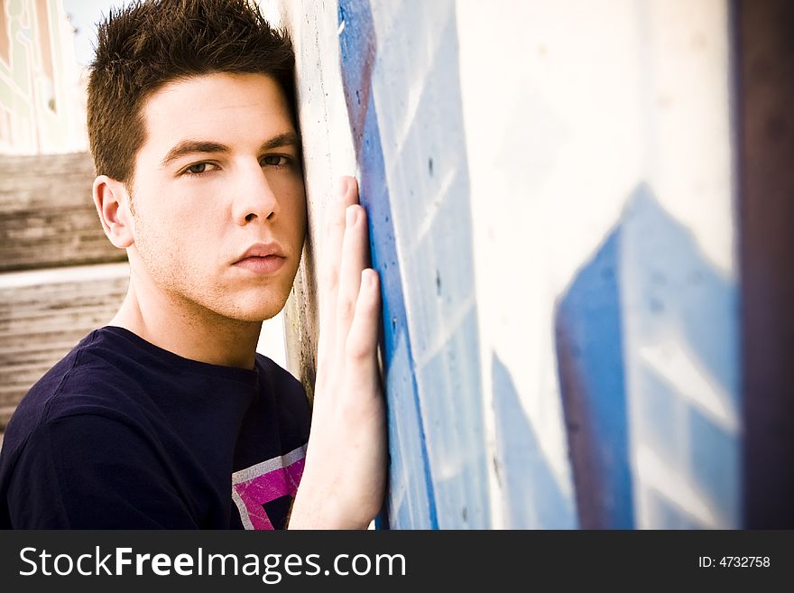 Young man portrait over grafted wall. Young man portrait over grafted wall.