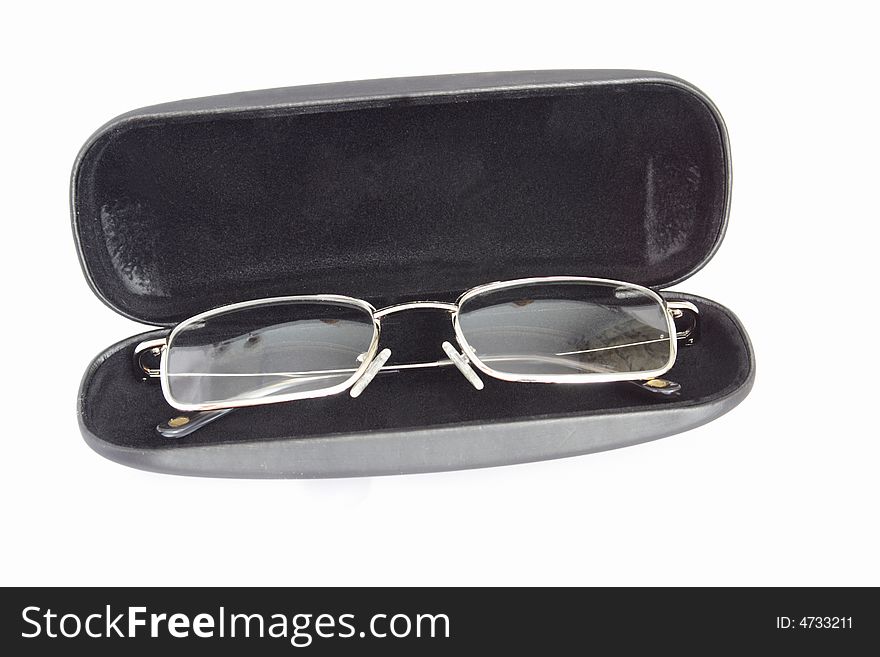 Transparent spectacles in black case on white background