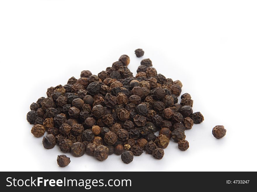 Black pepper polka dots on white background