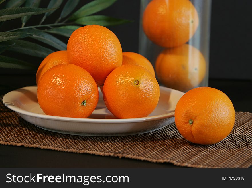 Wholesome oranges in a natural setting. Wholesome oranges in a natural setting.