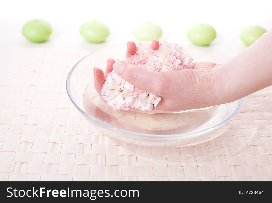 Female hands in bowl full of water