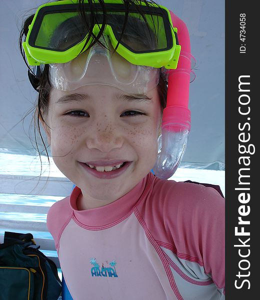 Girl with Snorkel and Mask getting ready to get in the water