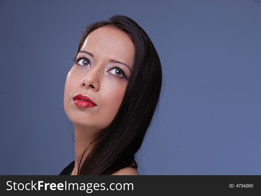 Captivating portrait of glamorous lady with beautiful dreaming eyes. Captivating portrait of glamorous lady with beautiful dreaming eyes