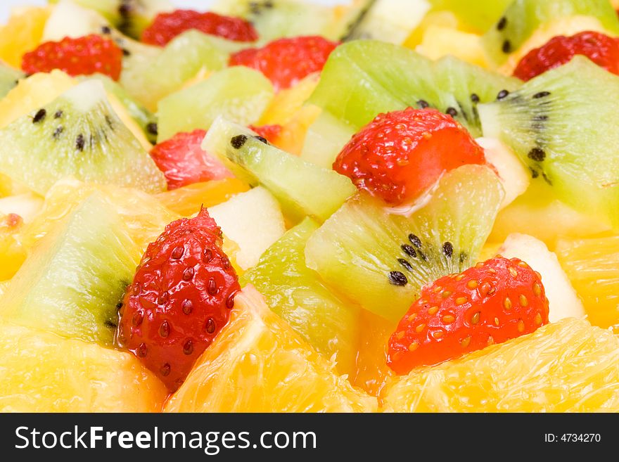 Background from salad from fresh appetizing fruit. Selective focus. Background from salad from fresh appetizing fruit. Selective focus.