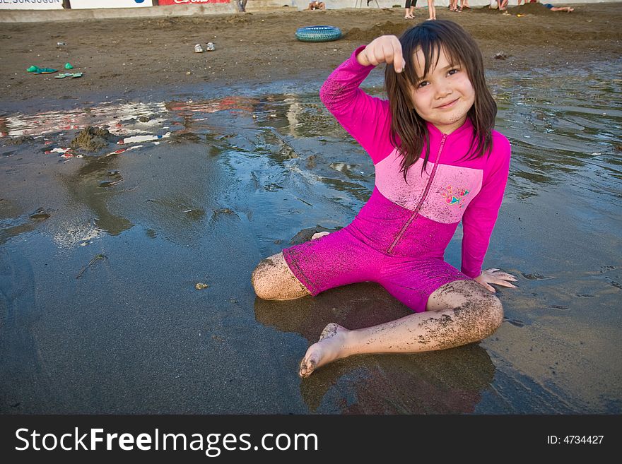 Girl Finding Shells On The Beach