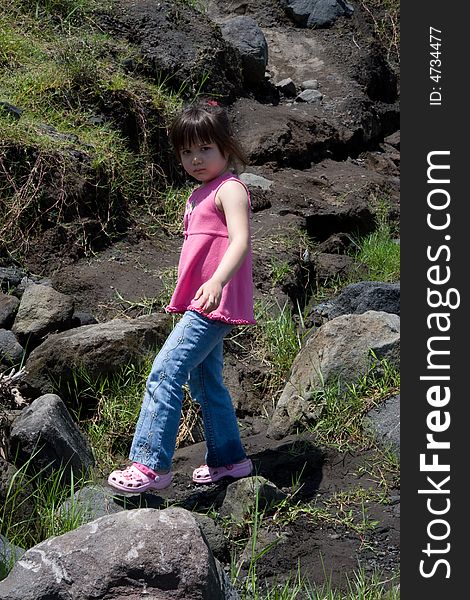 Girl Walking On Rocks