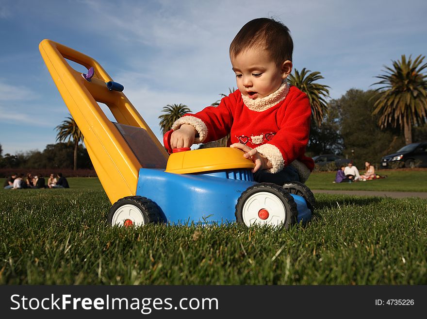 Adorable Baby Girl Playing In Grass