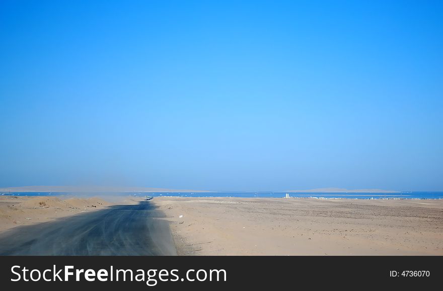 Road on the desert to the sea. Road on the desert to the sea.