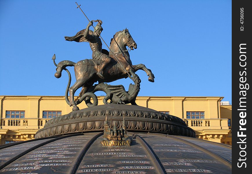 sculpture of the rider killing dragon, on roof of the building