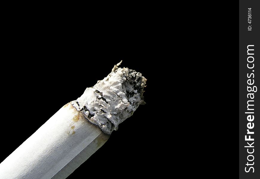 Cigaret close-up isolated on black blackground