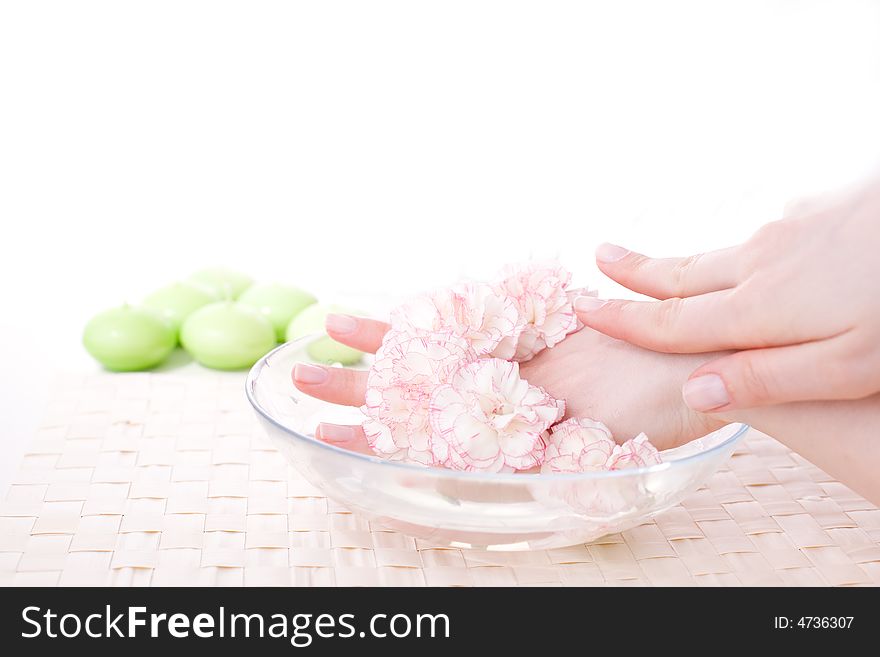 Female hands in bowl full of water