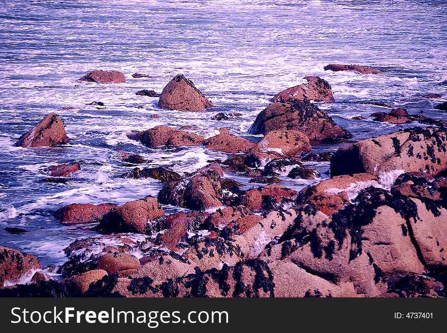 Chilly water bubbling on a rocky beach. Chilly water bubbling on a rocky beach