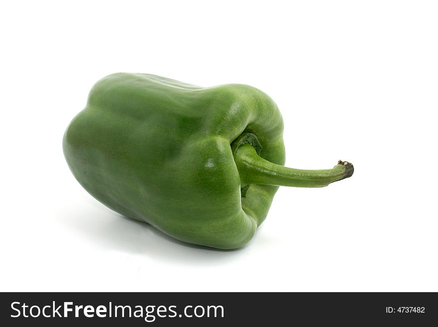 A green paprika on white background