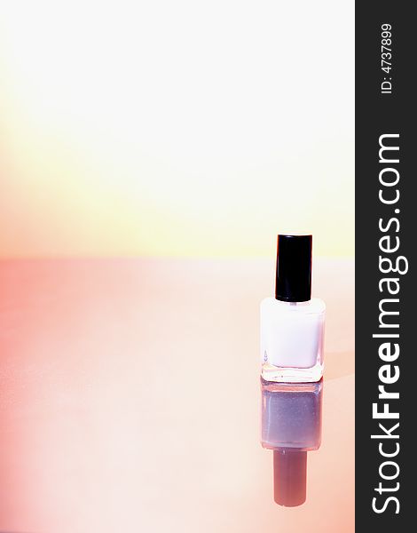 Bottle of nail polish on the sunshine background / copyspace