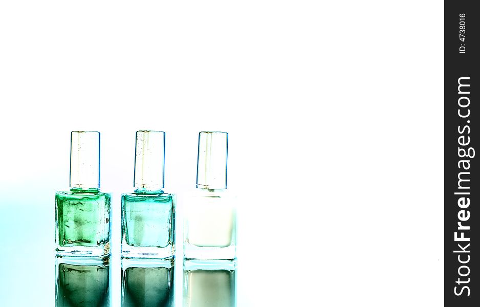 Three different bottle of nail polishes / copyspace / art