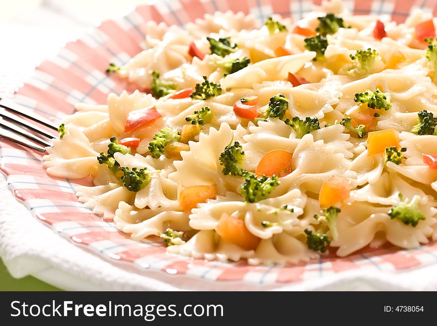 Macro picture of appetizing cooked pasta with vegetables