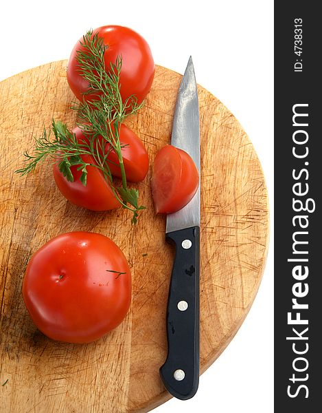 Three Tomatoes And Knife On  Little Table