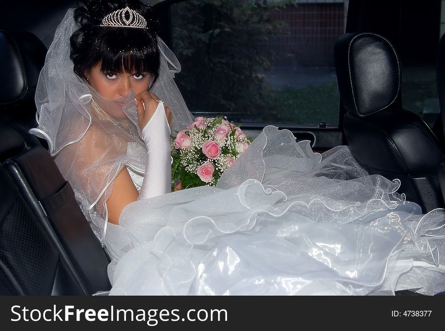 Portrait of a bride inside the car. Portrait of a bride inside the car