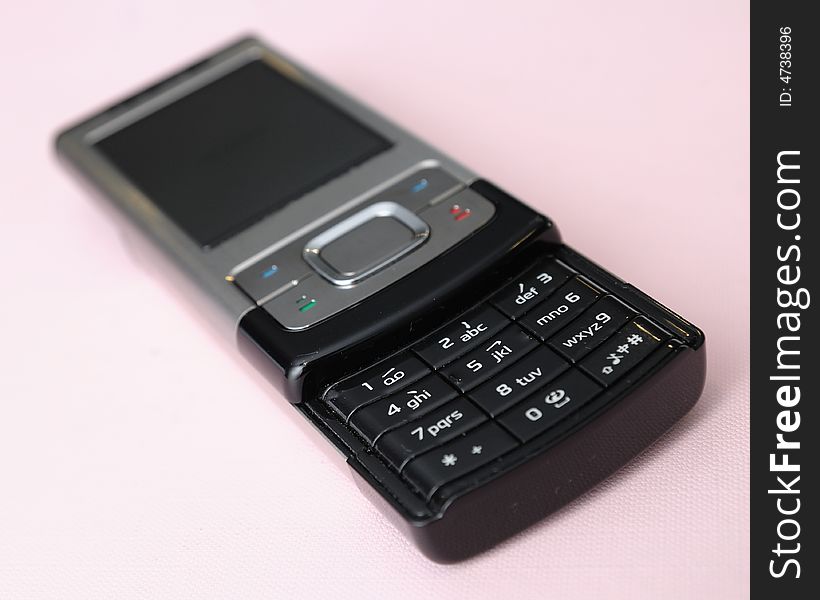 A 3g modern handphone on pink background