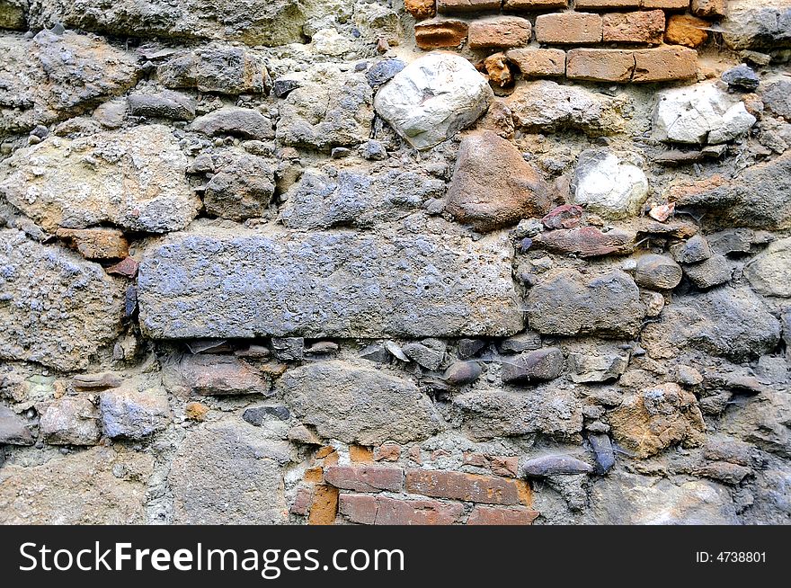 Old stone wall and bricks. Old stone wall and bricks