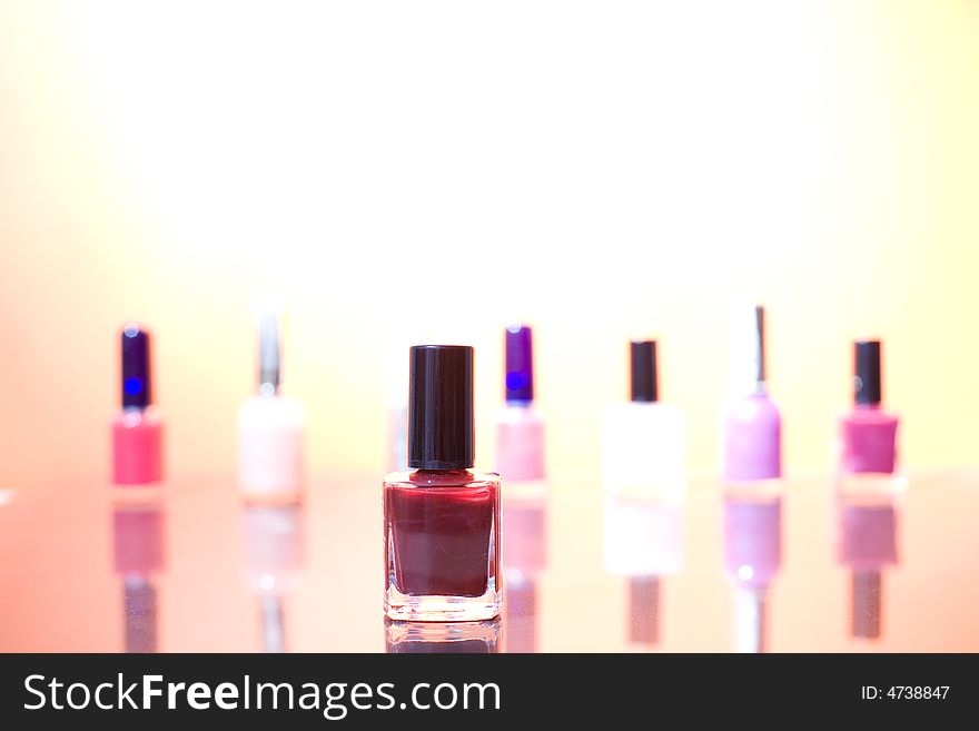 Group of different nail polishes on the sunshine background / copyspace