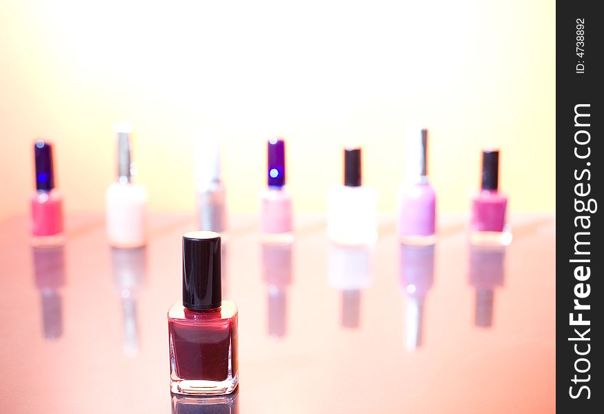 Group of different nail polishes on the sunshine background / copyspace. Group of different nail polishes on the sunshine background / copyspace