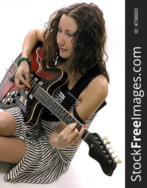 The nice girl plays on a guitar