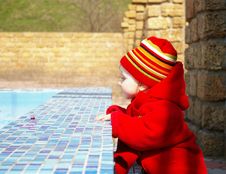 Little Girl Looks At The Thrown Pool Royalty Free Stock Photo