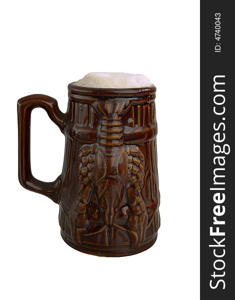 Beer in a clay mug over white