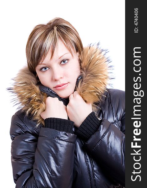 A congeal girl in a furry collar at the black winter jacket. A congeal girl in a furry collar at the black winter jacket