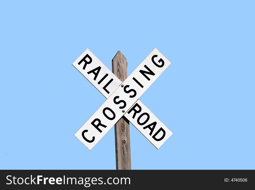 Railroad crossing sign on a clear sunny day