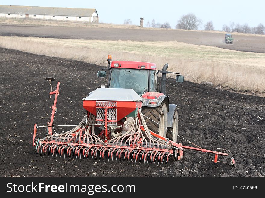 Machine harvesting the corn field