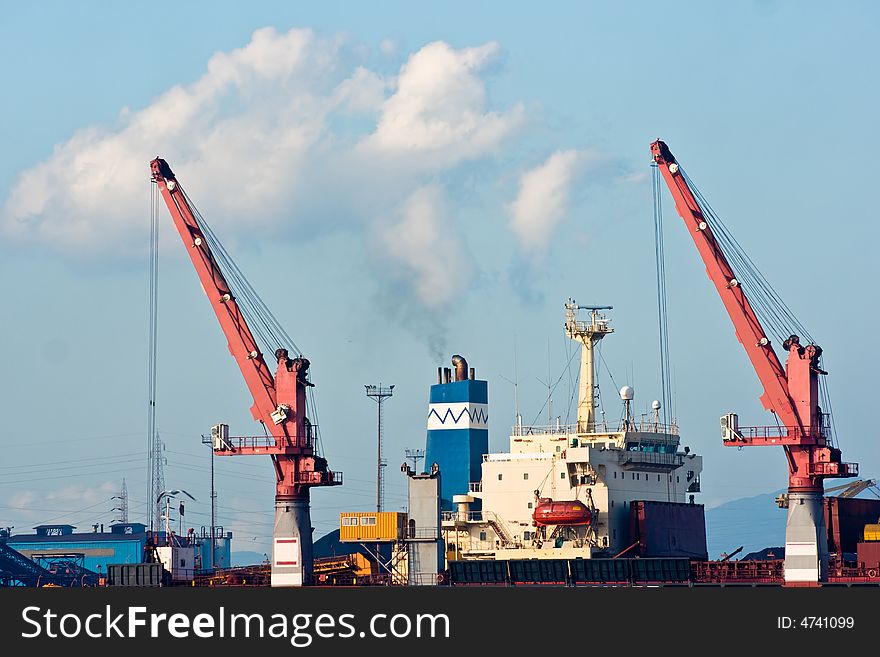 Crane in Piombino harbor, Tuscany, Italy. Crane in Piombino harbor, Tuscany, Italy.